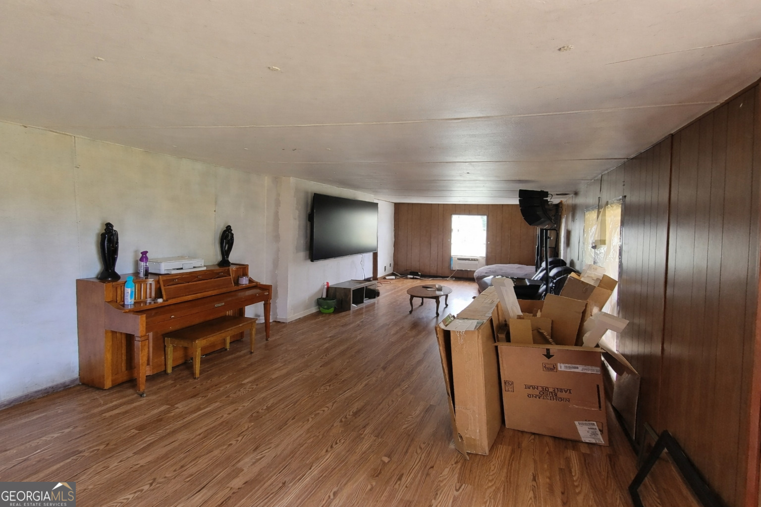 200 Homer Stephens Road Cornelia, GA 30531 - Photo 6 of 16 a living room with furniture and a flat screen tv