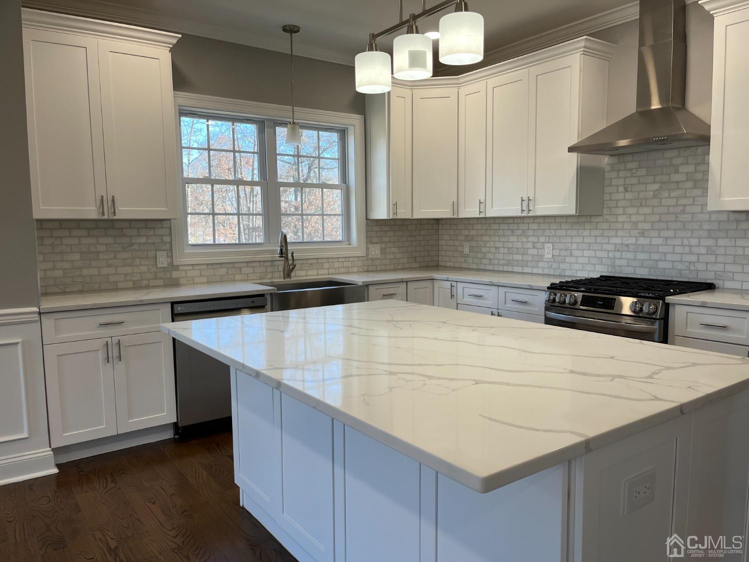 80 Kimberly Road Colonia, NJ 07067 - Photo 13 of 33 a kitchen with cabinets appliances a sink and a window