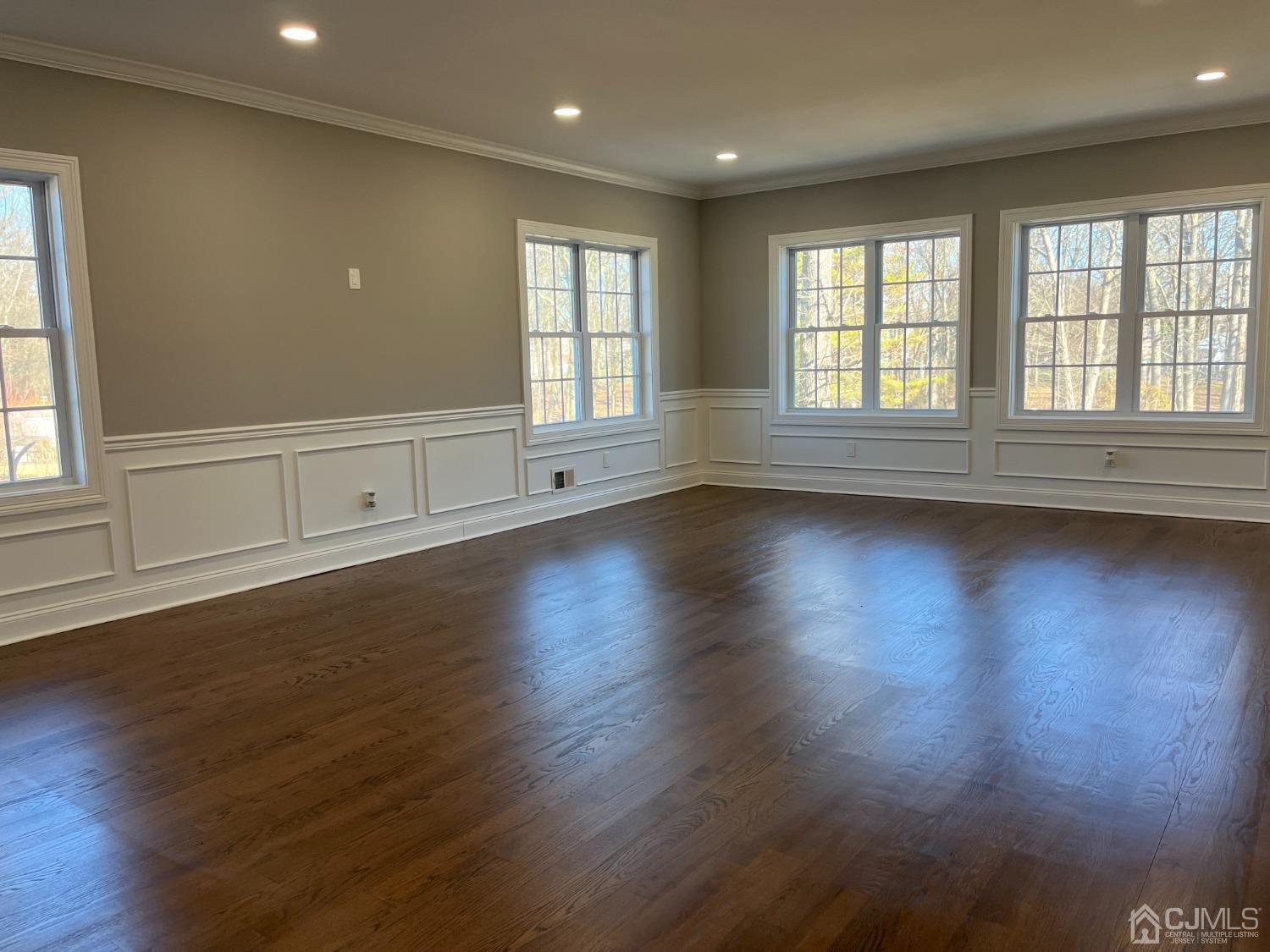 80 Kimberly Road Colonia, NJ 07067 - Photo 18 of 33 an empty room with wooden floor and windows