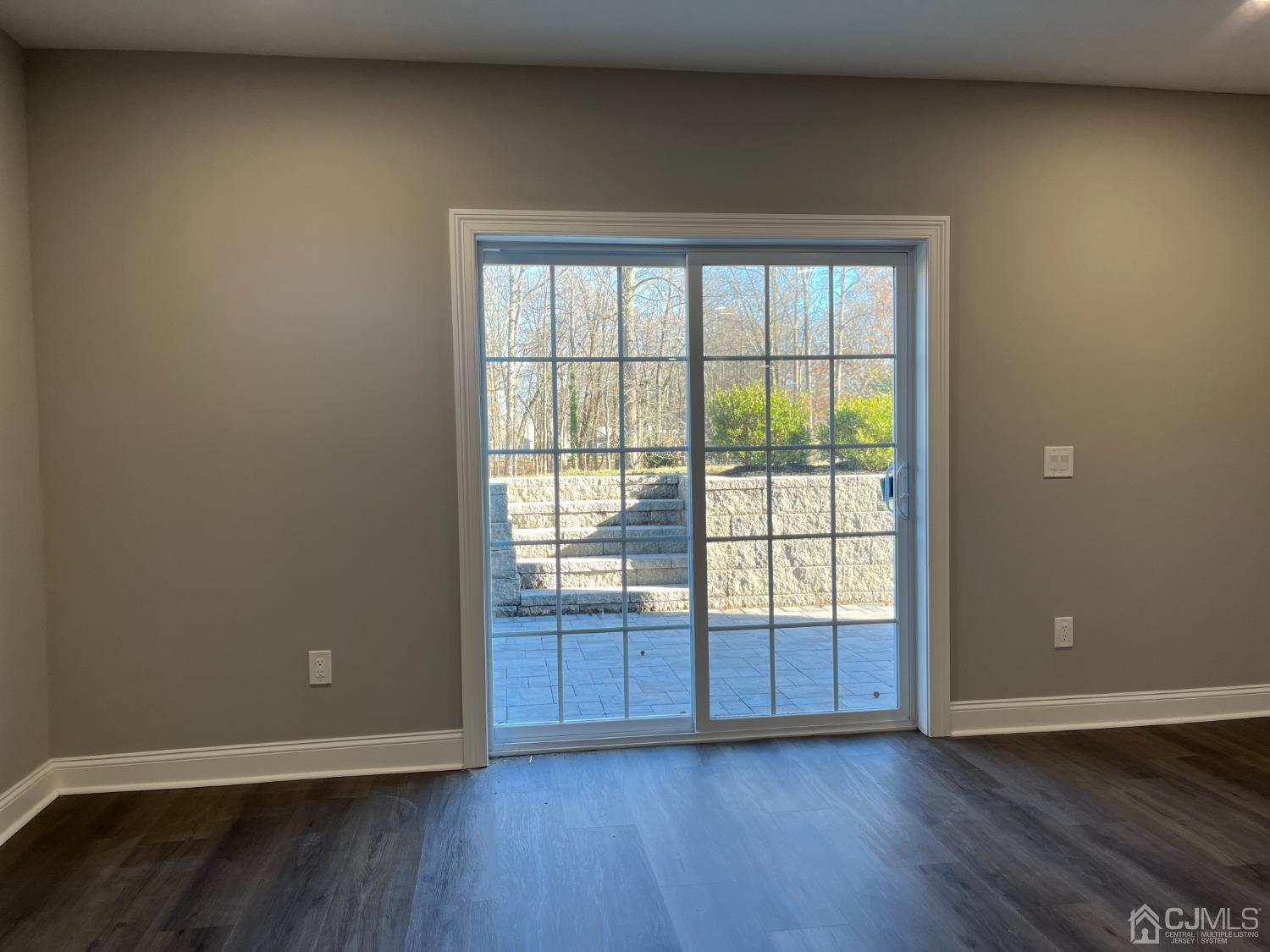 80 Kimberly Road Colonia, NJ 07067 - Photo 25 of 33 an empty room with wooden floor and windows