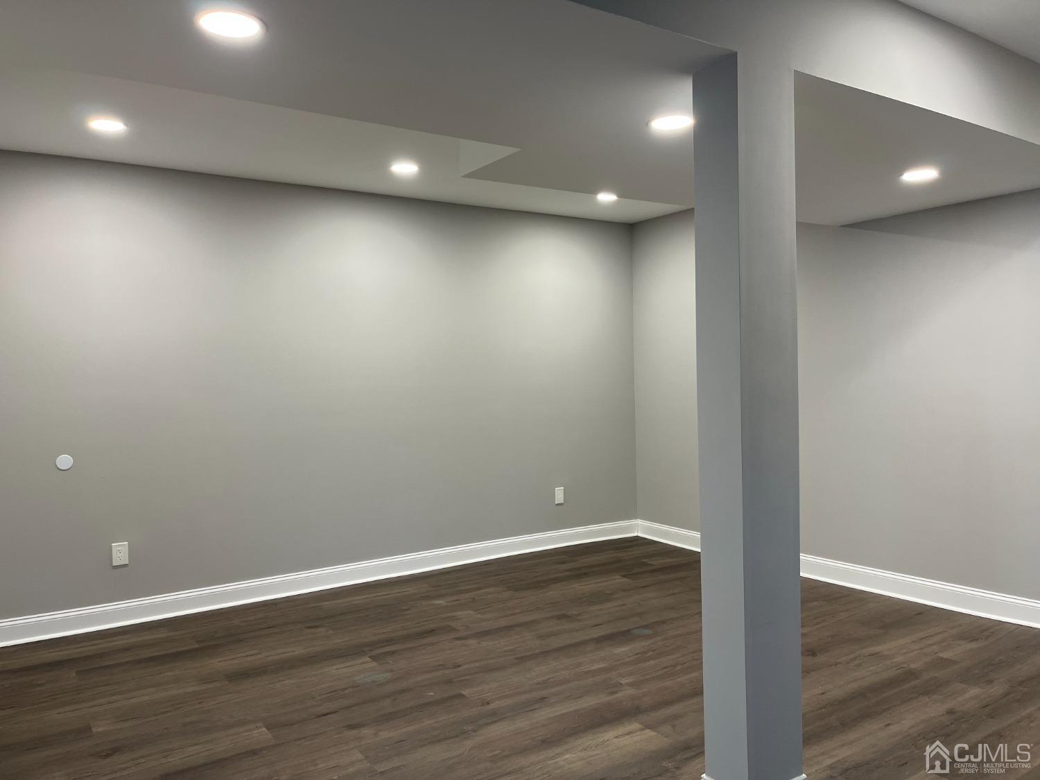 80 Kimberly Road Colonia, NJ 07067 - Photo 26 of 33 an empty room with wooden floor and windows