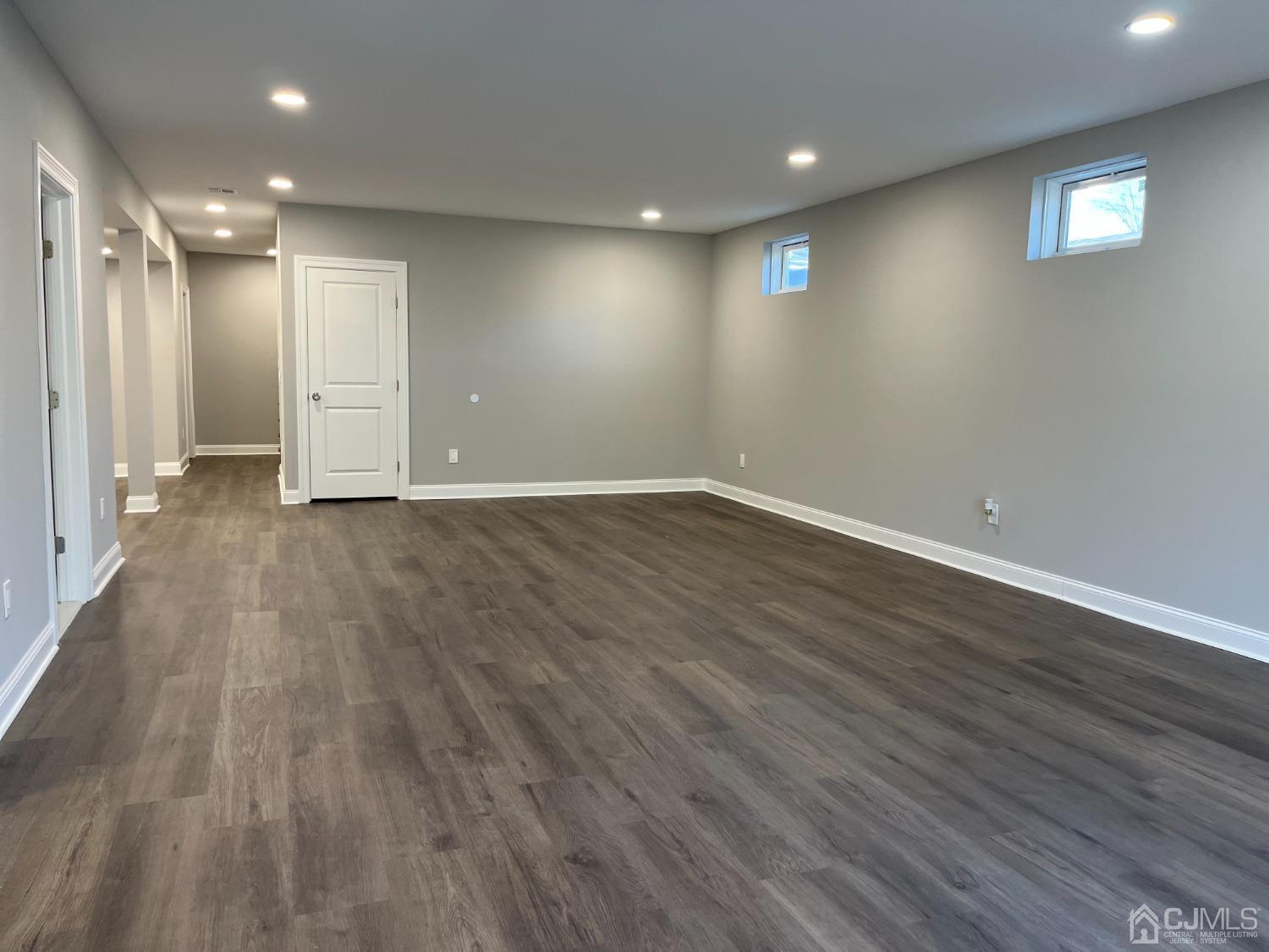 80 Kimberly Road Colonia, NJ 07067 - Photo 27 of 33 a view of an empty room with wooden floor and a window