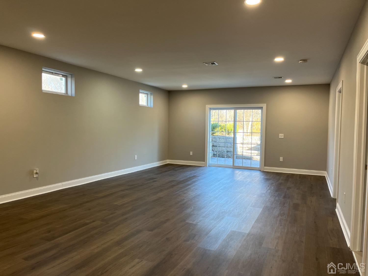 80 Kimberly Road Colonia, NJ 07067 - Photo 28 of 33 a view of an empty room with wooden floor and a window