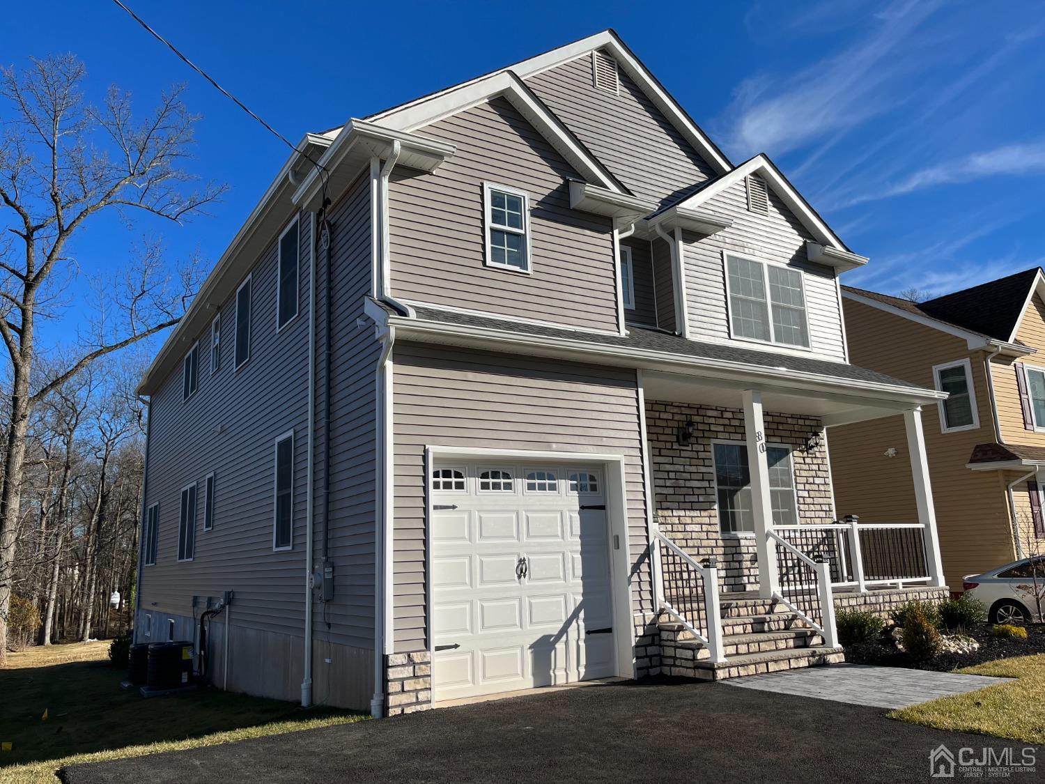 80 Kimberly Road Colonia, NJ 07067 - Photo 3 of 33 a front view of a house with a yard