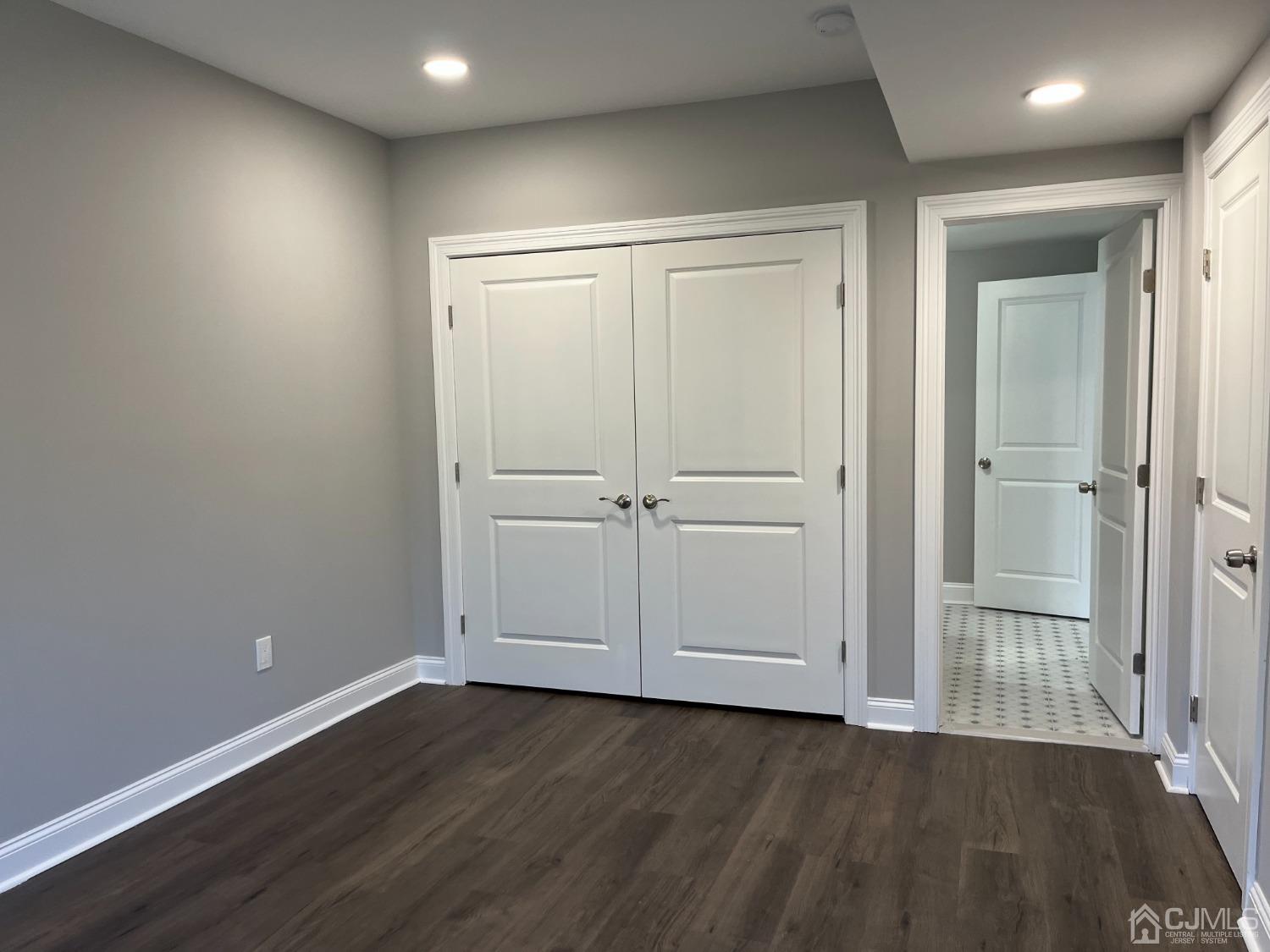 80 Kimberly Road Colonia, NJ 07067 - Photo 31 of 33 an empty room with wooden floor