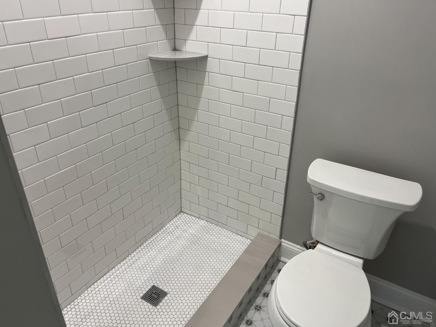 80 Kimberly Road Colonia, NJ 07067 - Photo 32 of 33 a white toilet sitting next to a bathroom sink