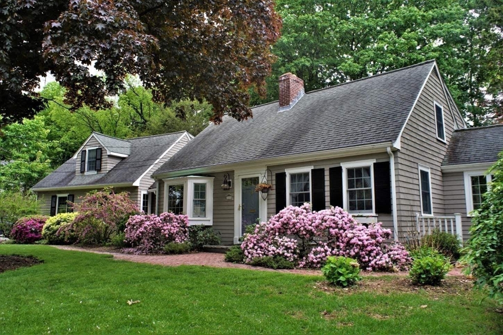 2270 Massachusetts Avenue Lexington, MA 02421 - Photo 1 of 34 a front view of a house with a garden