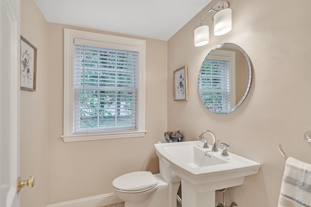 2270 Massachusetts Avenue Lexington, MA 02421 - Photo 12 of 34 a bathroom with a toilet a sink and a mirror