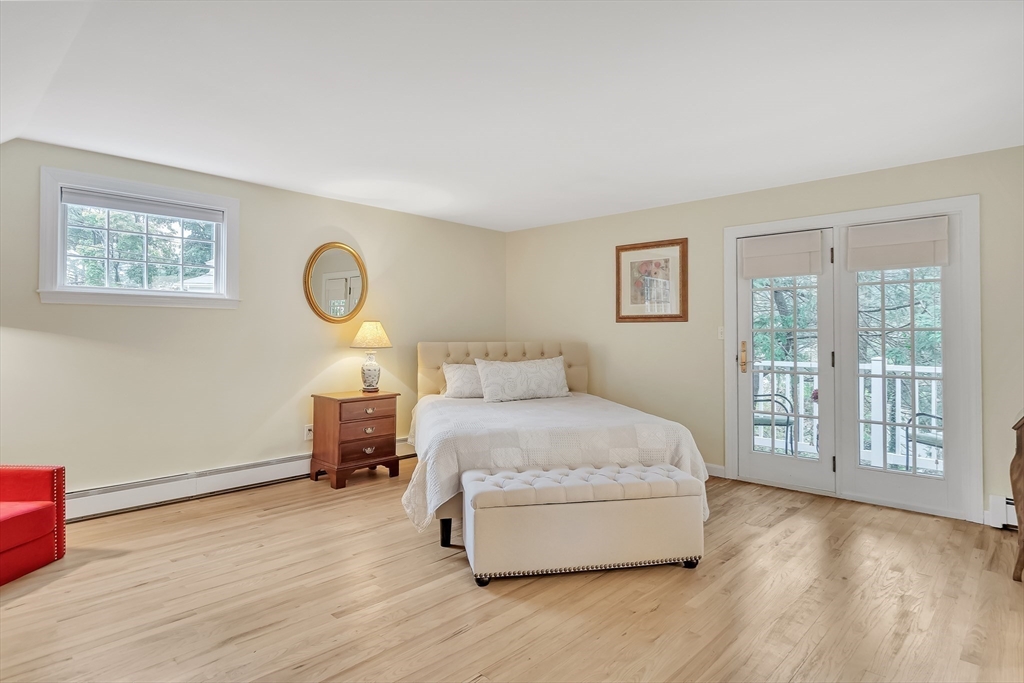 2270 Massachusetts Avenue Lexington, MA 02421 - Photo 15 of 34 a spacious bedroom with a bed and a large window