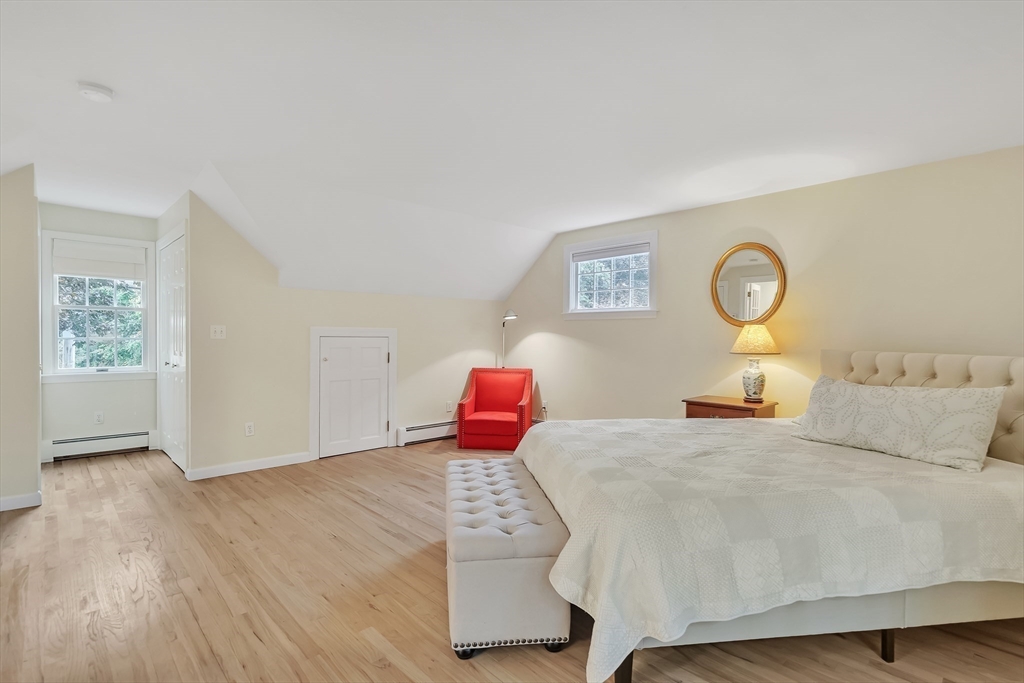2270 Massachusetts Avenue Lexington, MA 02421 - Photo 16 of 34 a bedroom with a bed and lamp