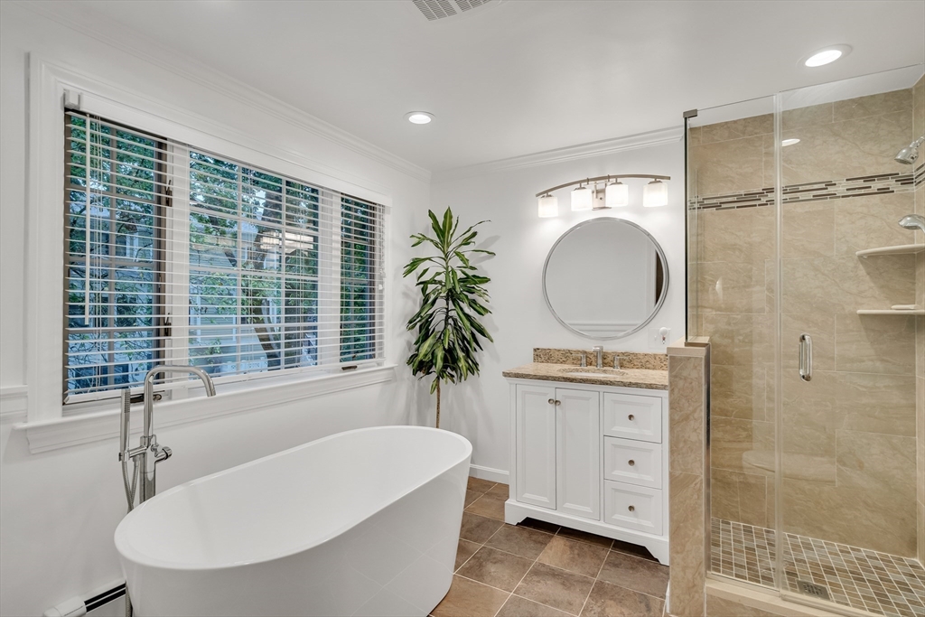 2270 Massachusetts Avenue Lexington, MA 02421 - Photo 17 of 34 a bathroom with a tub a sink and a mirror