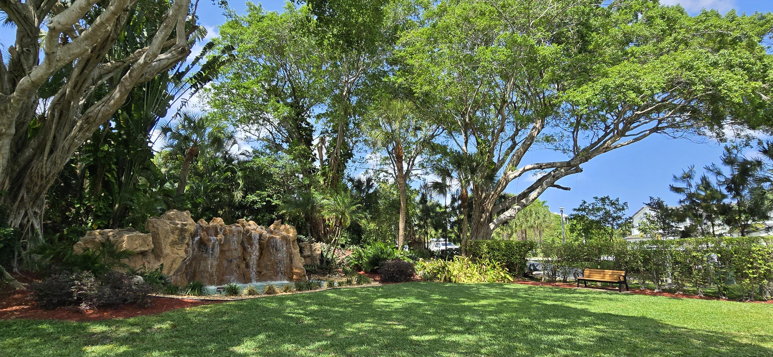 6062 Glendale Drive Boca Raton, FL 33433 - Photo 52 of 58 Waterfall entrance w bench