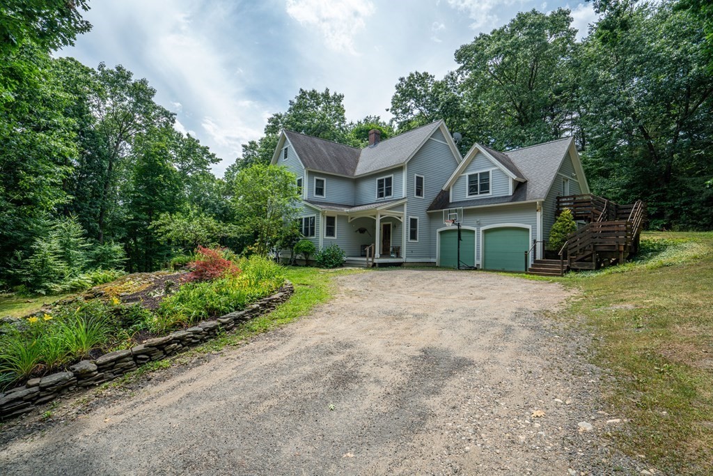 16 Long Hill Road Leverett, MA 01054 - Photo 1 of 38 a house with trees in the background