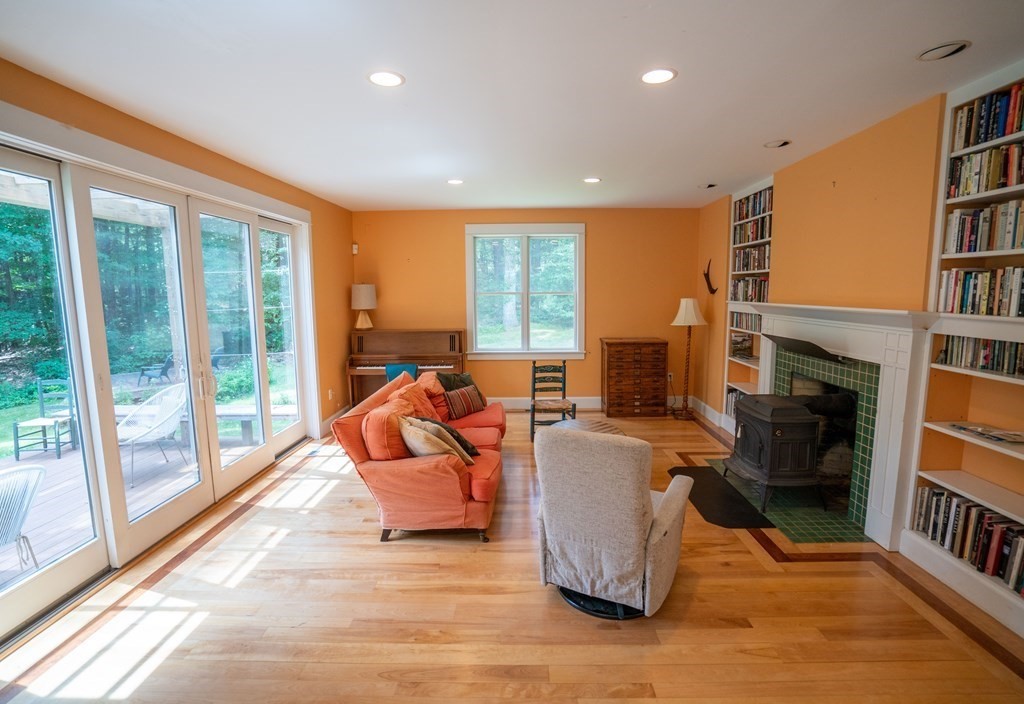 16 Long Hill Road Leverett, MA 01054 - Photo 11 of 38 a living room with fireplace furniture and a large window