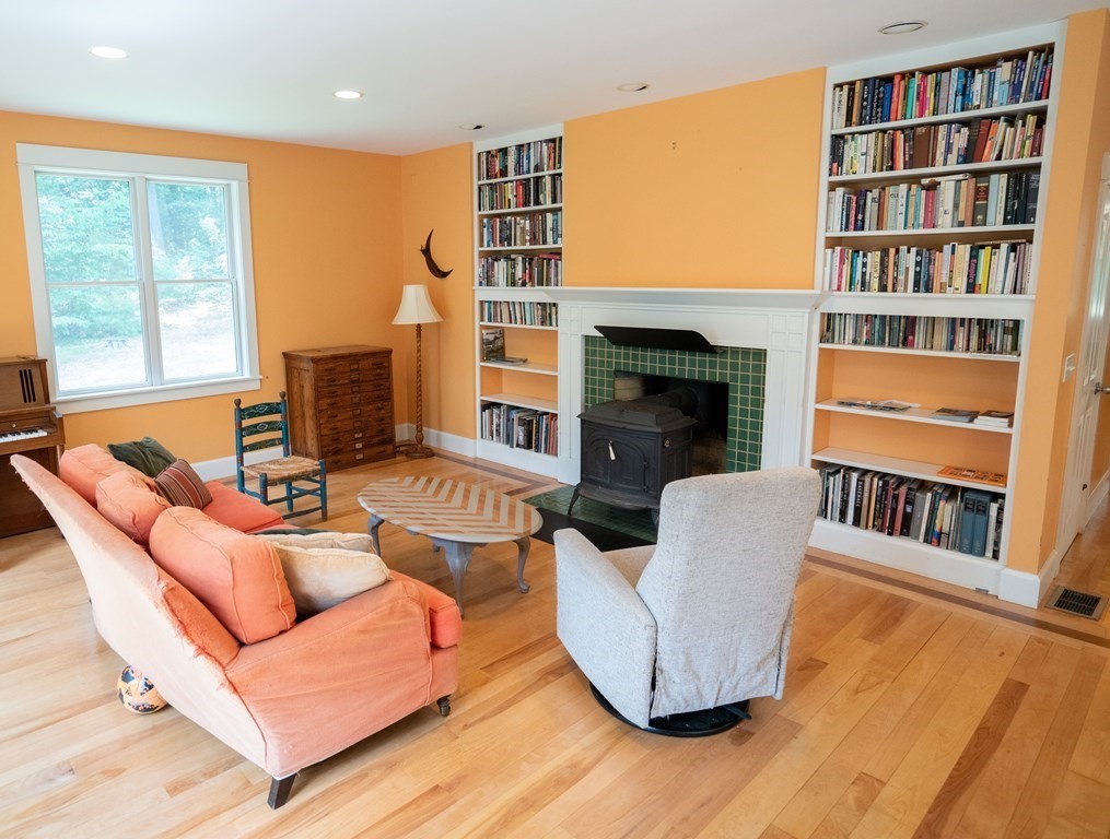 16 Long Hill Road Leverett, MA 01054 - Photo 12 of 38 a living room with furniture and a fireplace
