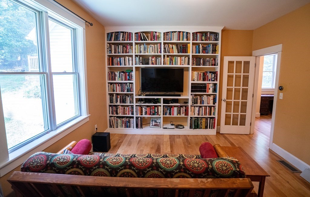 16 Long Hill Road Leverett, MA 01054 - Photo 16 of 38 a living room with furniture and a flat screen tv