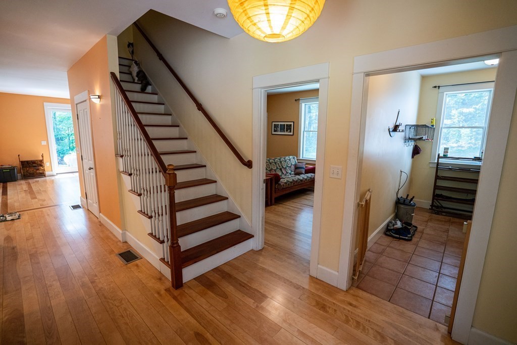 16 Long Hill Road Leverett, MA 01054 - Photo 20 of 38 a view of a hallway with wooden floor and staircase