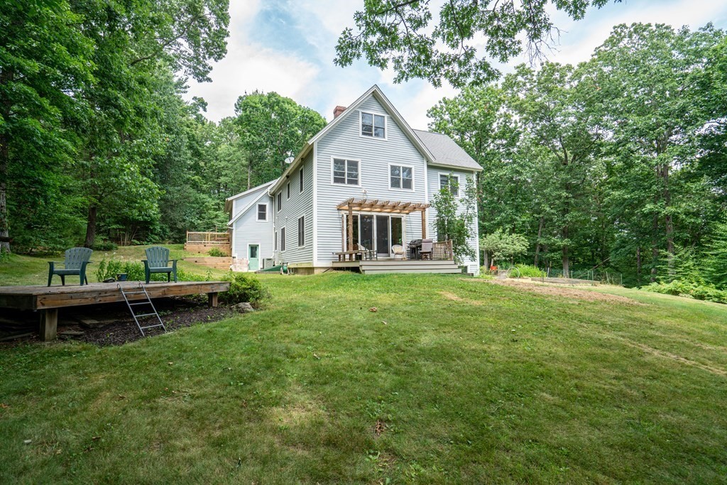16 Long Hill Road Leverett, MA 01054 - Photo 2 of 38 a front view of a house with a yard and fence