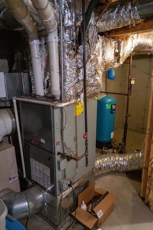 16 Long Hill Road Leverett, MA 01054 - Photo 33 of 38 a room with water heater and wooden walls
