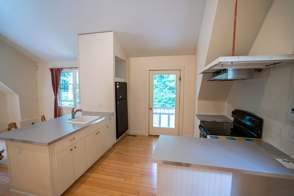 16 Long Hill Road Leverett, MA 01054 - Photo 35 of 38 a kitchen with a sink and a stove top oven
