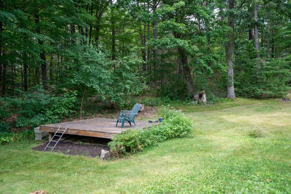 16 Long Hill Road Leverett, MA 01054 - Photo 4 of 38 a view of a wooden deck with chairs and a yard