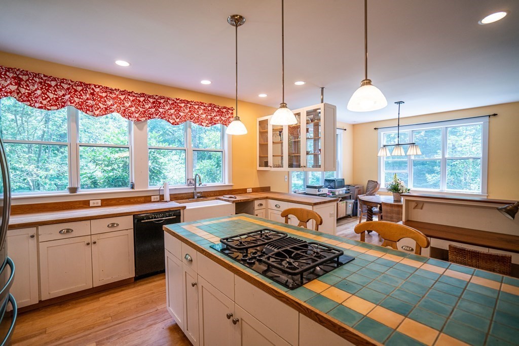 16 Long Hill Road Leverett, MA 01054 - Photo 10 of 38 a kitchen with stainless steel appliances granite countertop a stove a sink and a wooden floors