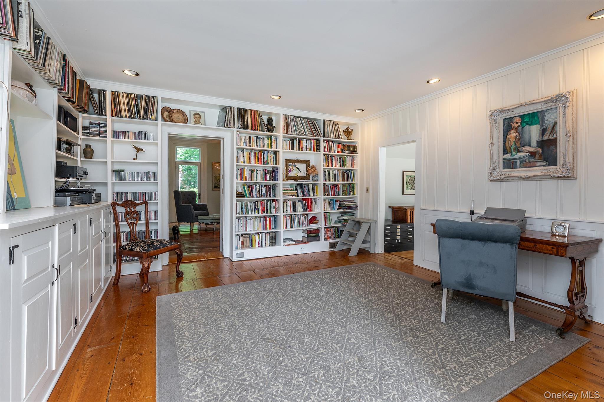 202 Buckwheat Road Hudson, NY 12534 - Photo 16 of 49 a living room with furniture and a bookshelf