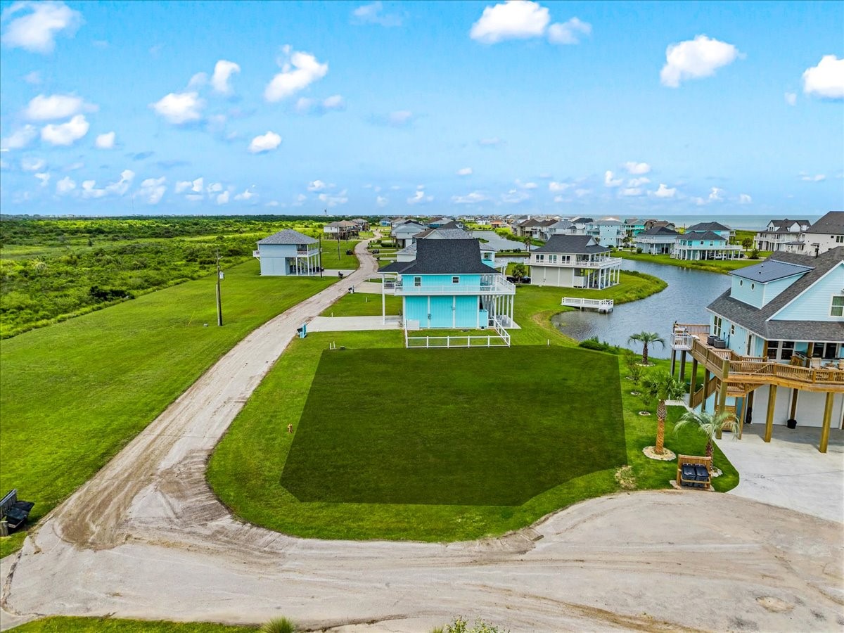 3606 Marble Street Port Bolivar, TX 77650 - Photo 3 of 8 a view of a swimming pool with a yard