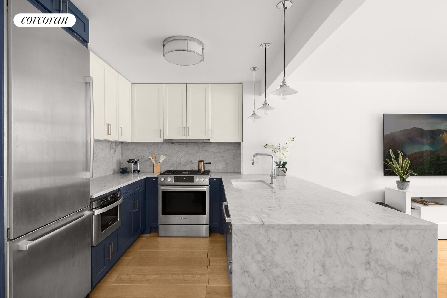 a kitchen with stainless steel appliances granite countertop a sink a stove and a refrigerator