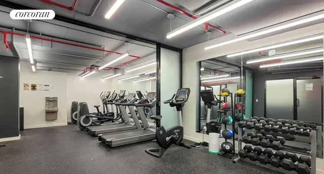 a view of game room with gym equipment