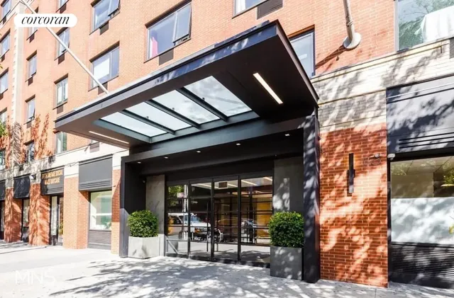 a view of a building with a tree