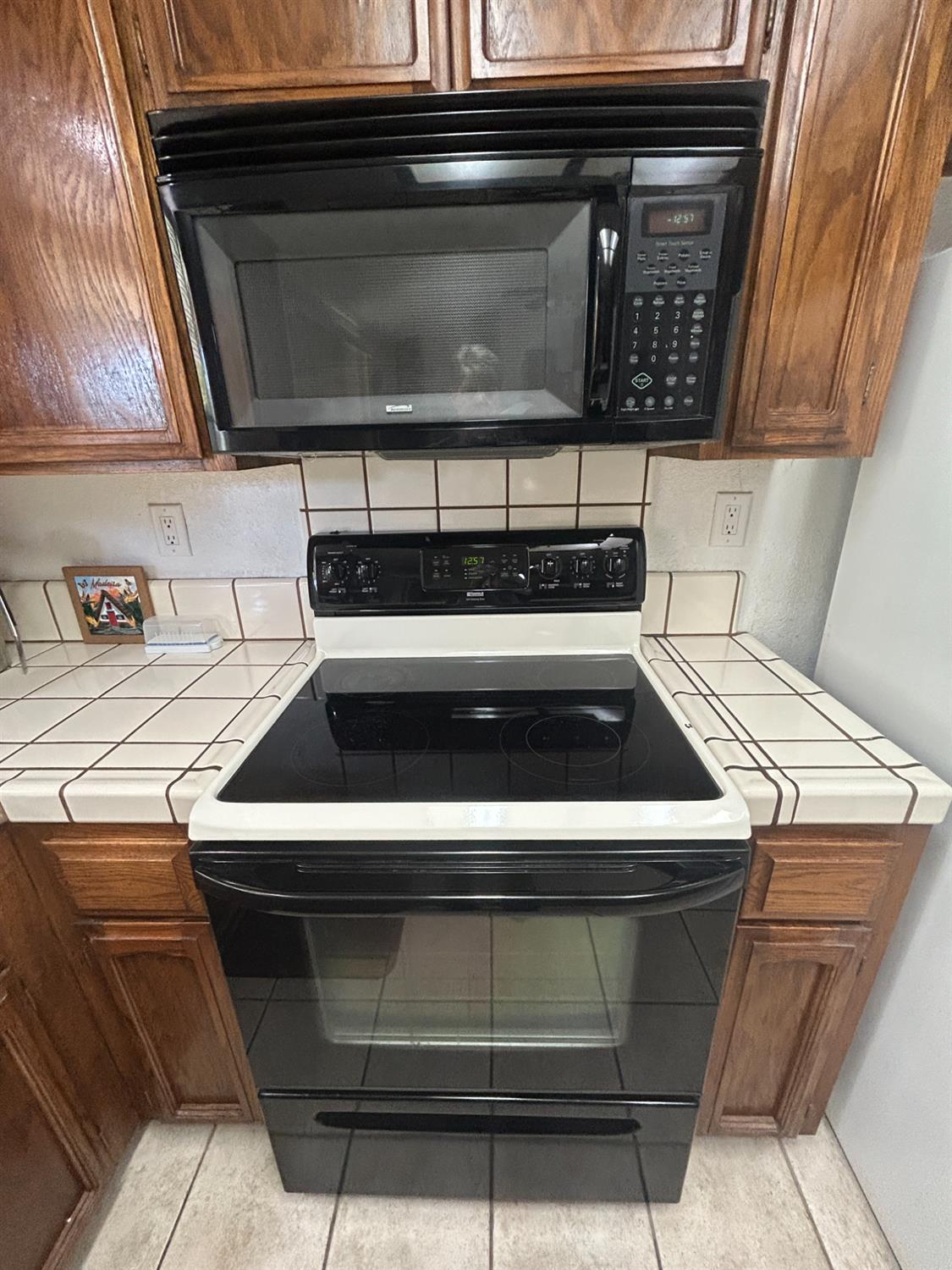 4529 Fallbrook Place Salida, CA 95368 - Photo 12 of 26 a stove top oven sitting inside of a kitchen