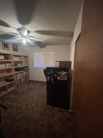 a kitchen with kitchen island a stove and a refrigerator