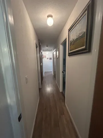 a view of gallery with wooden floor