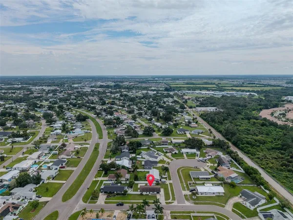an aerial view of residential houses with outdoor space