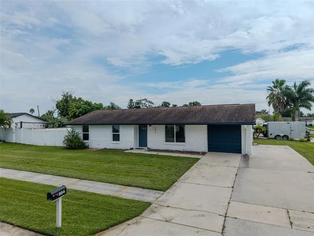 a view of front of house with a swimming pool