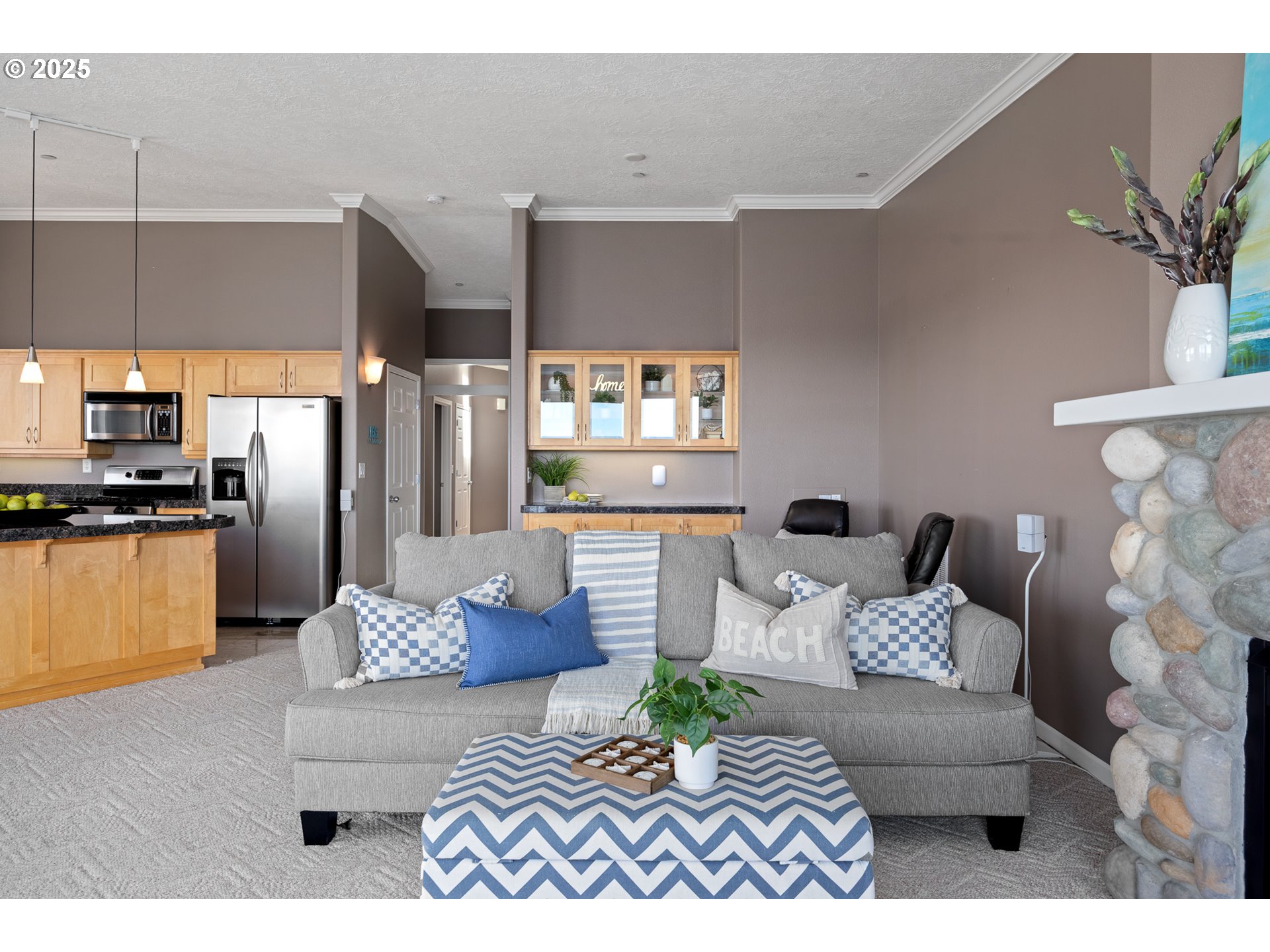 1113 Highway 101, Unit 52 Depoe Bay, OR 97341 - Photo 11 of 47 a living room with furniture kitchen view and a window