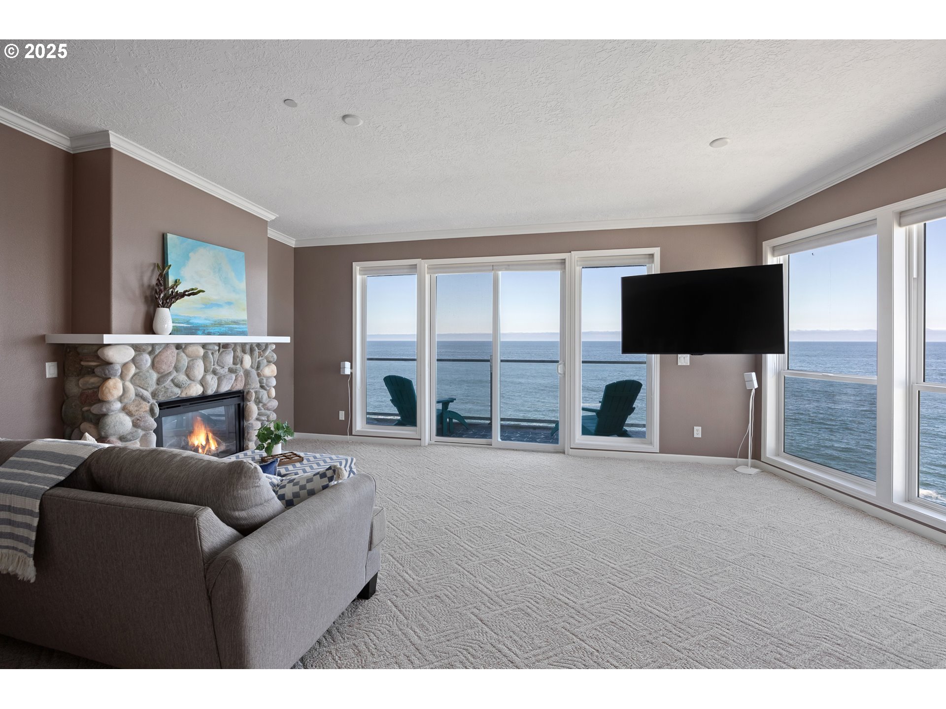 1113 Highway 101, Unit 52 Depoe Bay, OR 97341 - Photo 13 of 47 a living room with furniture and a flat screen tv