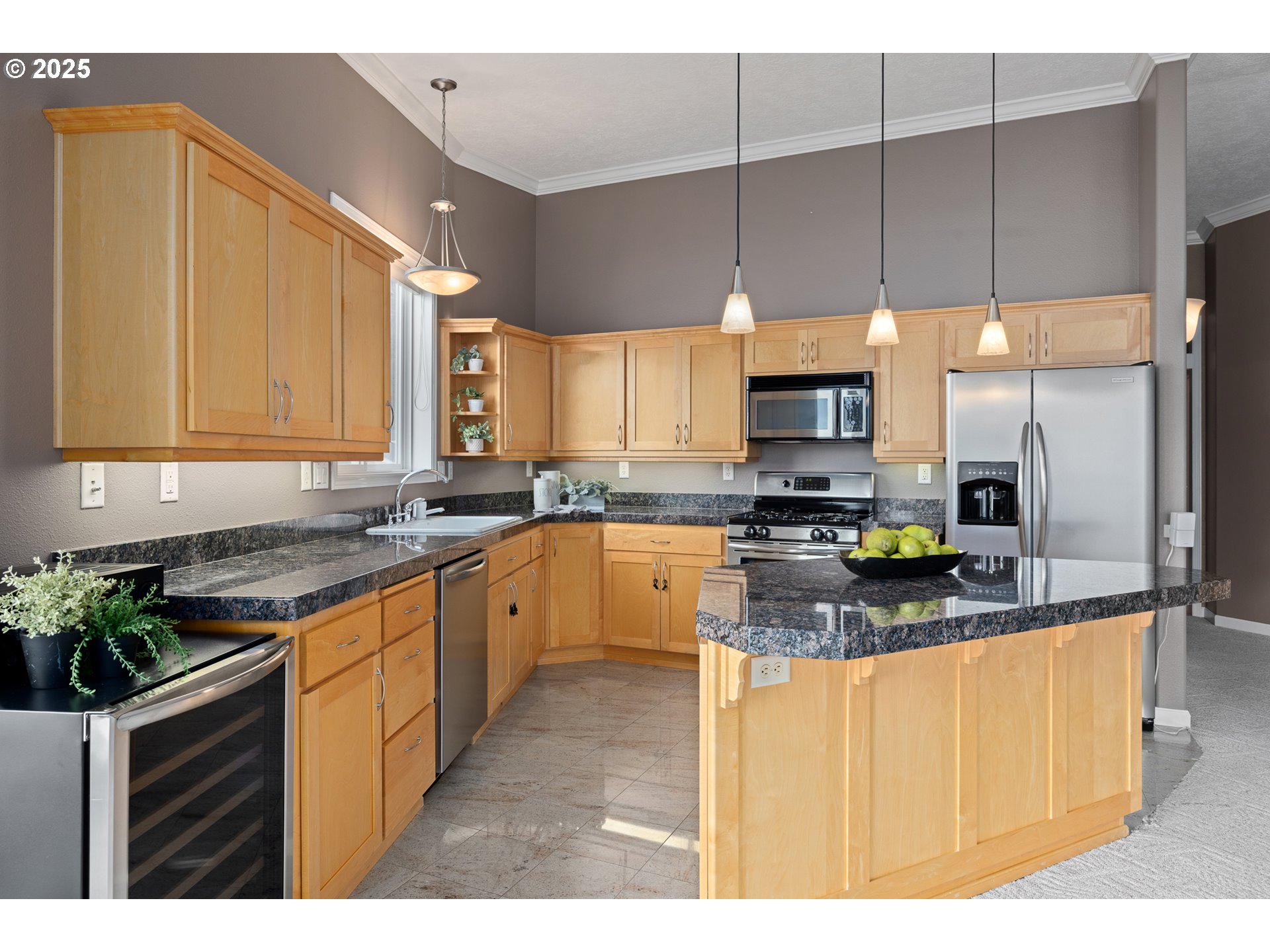 1113 Highway 101, Unit 52 Depoe Bay, OR 97341 - Photo 18 of 47 a kitchen with stainless steel appliances granite countertop a stove a sink and a microwave