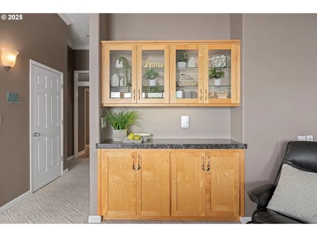 a view of living room with a table and windows
