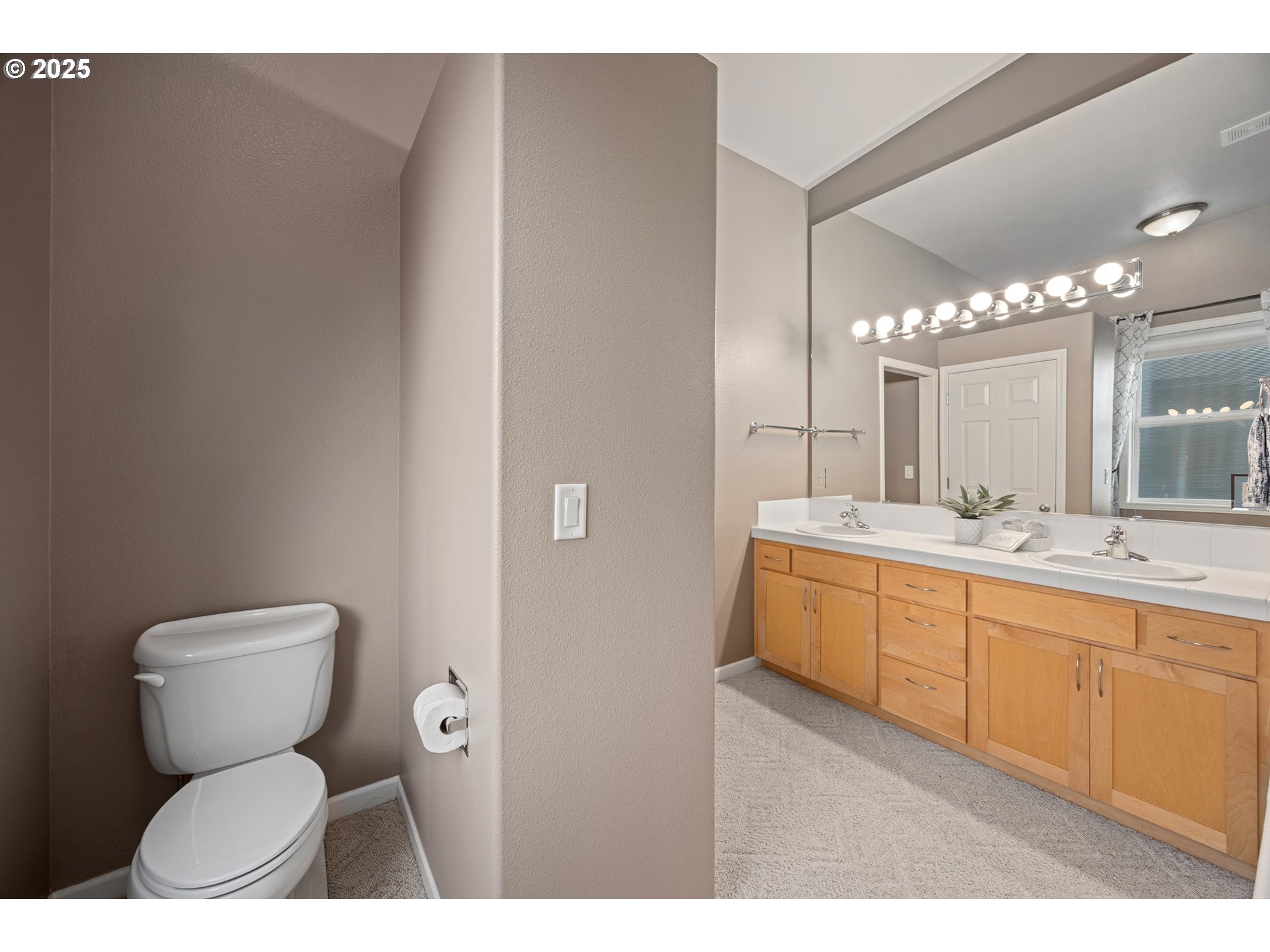 1113 Highway 101, Unit 52 Depoe Bay, OR 97341 - Photo 33 of 47 a bathroom with a toilet sink and mirror