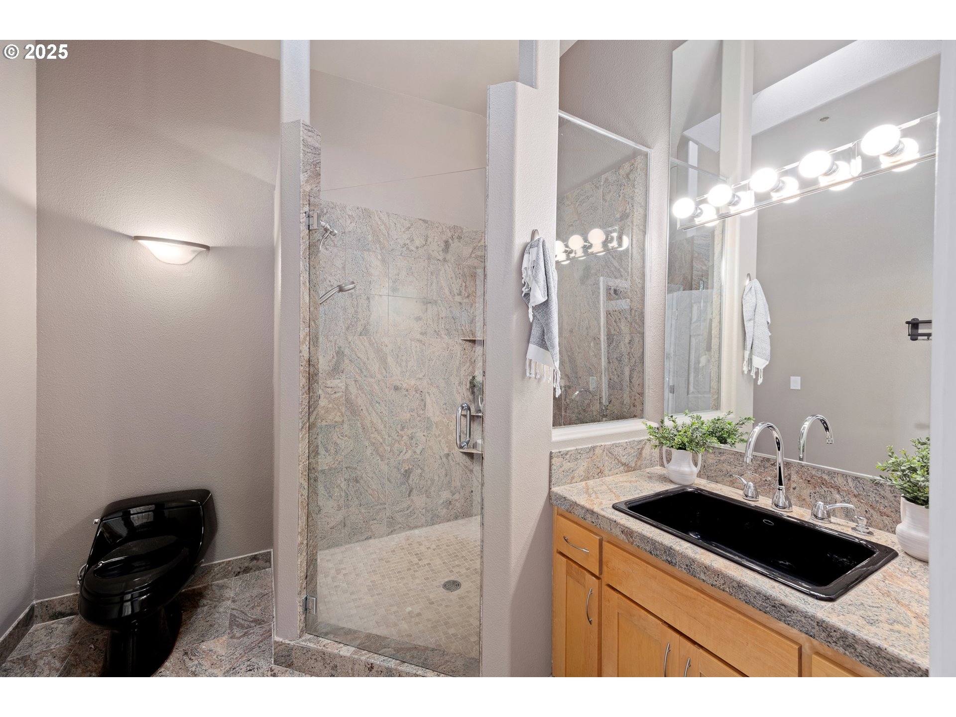 1113 Highway 101, Unit 52 Depoe Bay, OR 97341 - Photo 36 of 47 a bathroom with a sink a mirror and a shower