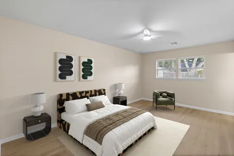 a bedroom with a bed and a couch