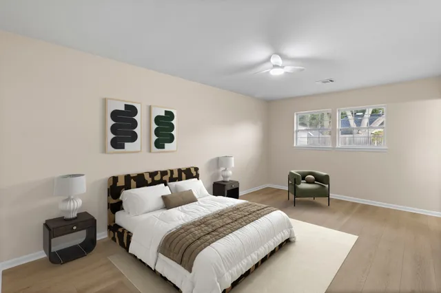 a bedroom with a bed and a couch