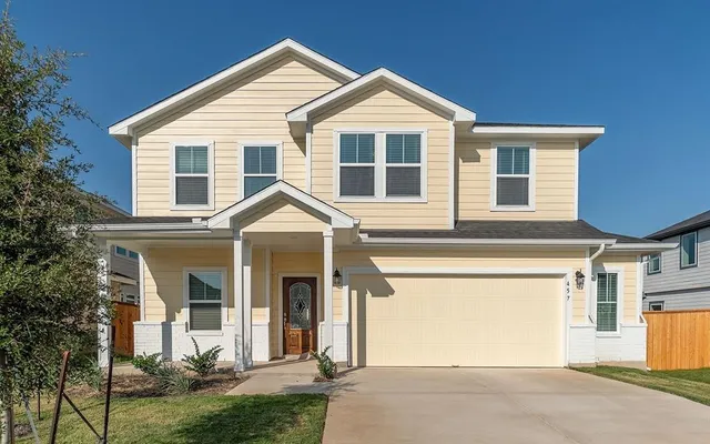 front view of a house with a yard