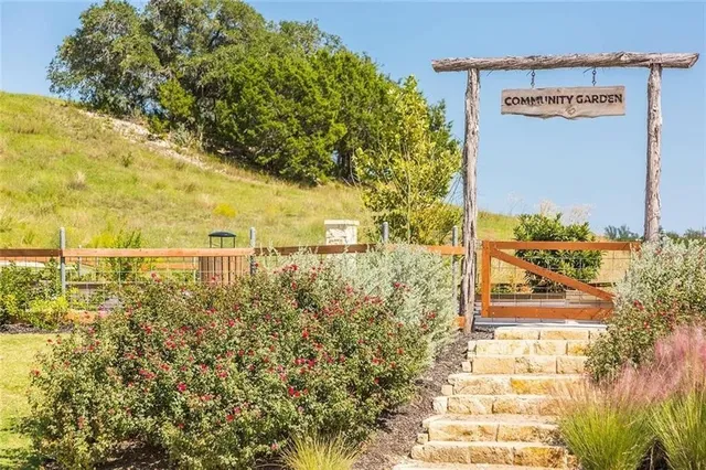 an outdoor space with patio and white umbrellas