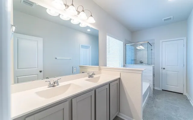 a bathroom with a sink a vanity and a mirror