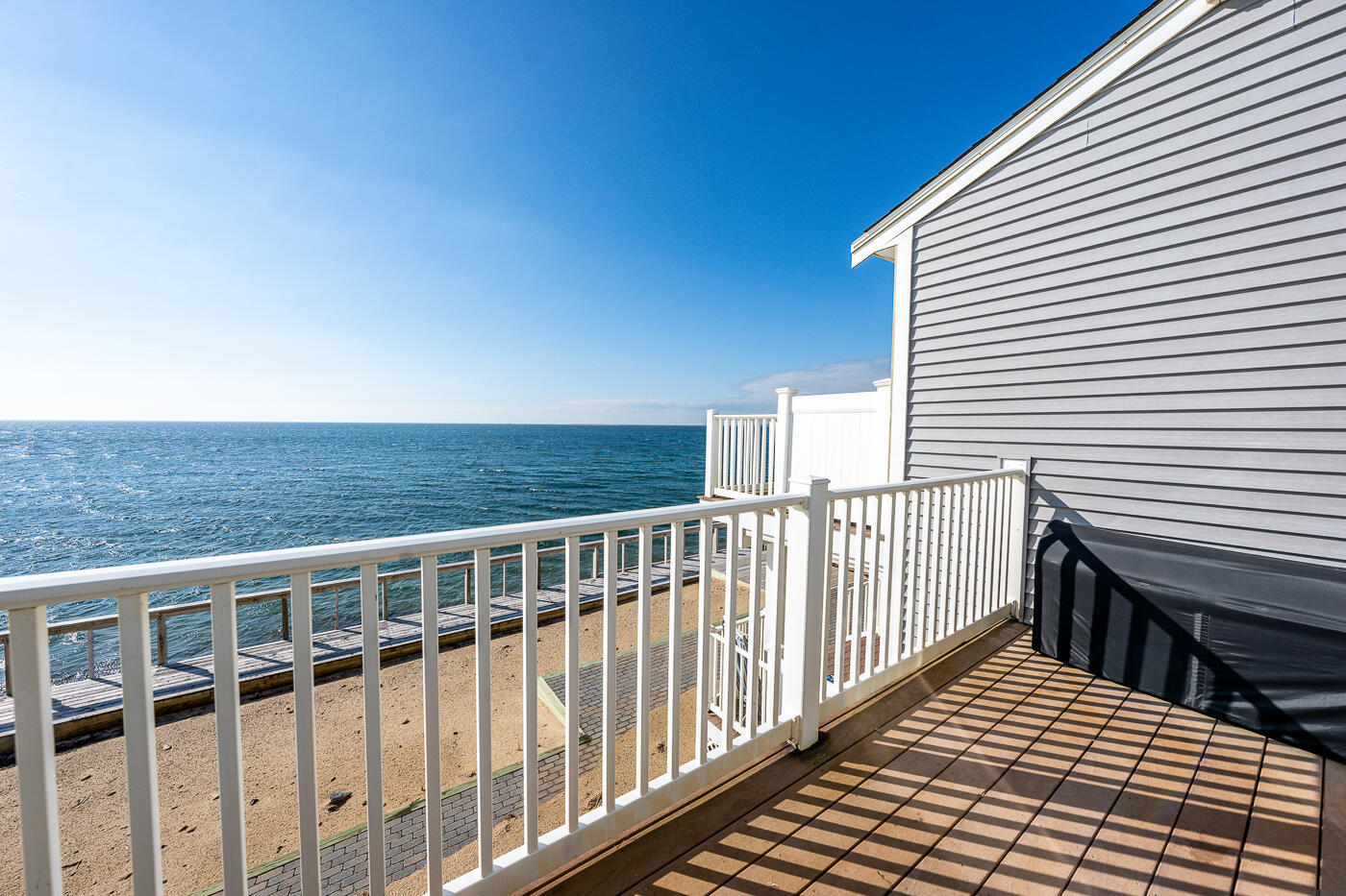 482 Shore Road, Unit 19 Truro, MA 02666 - Photo 12 of 17 a view of a balcony with wooden floor