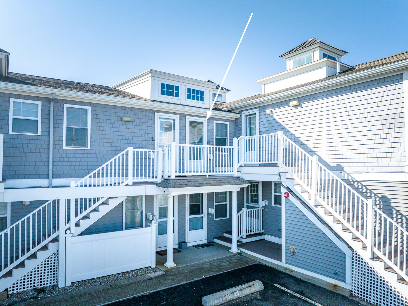 482 Shore Road, Unit 19 Truro, MA 02666 - Photo 13 of 17 a front view of a house with a deck