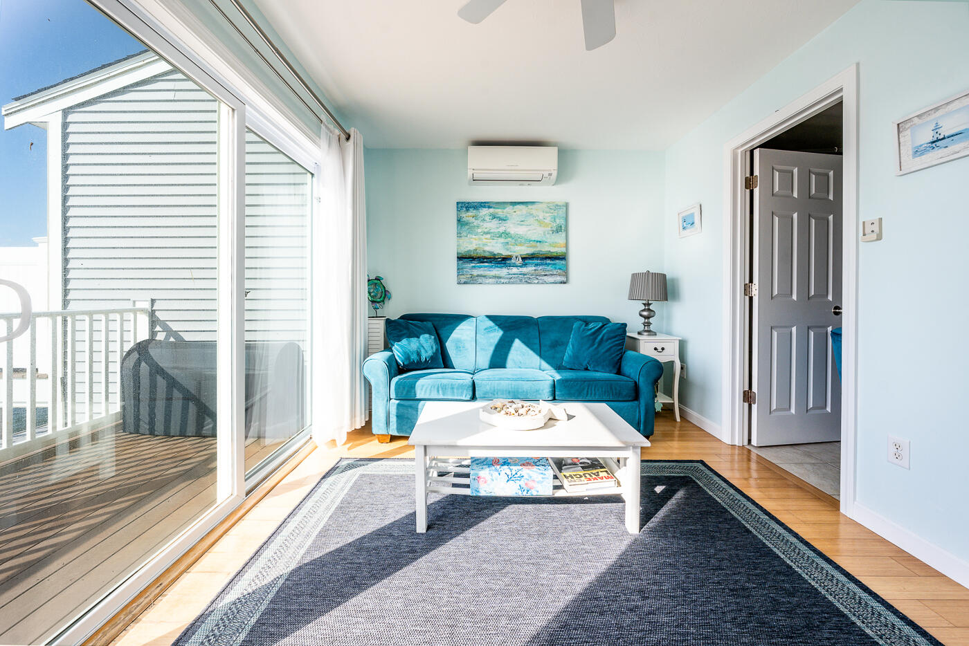 482 Shore Road, Unit 19 Truro, MA 02666 - Photo 4 of 17 a living room with furniture and a rug